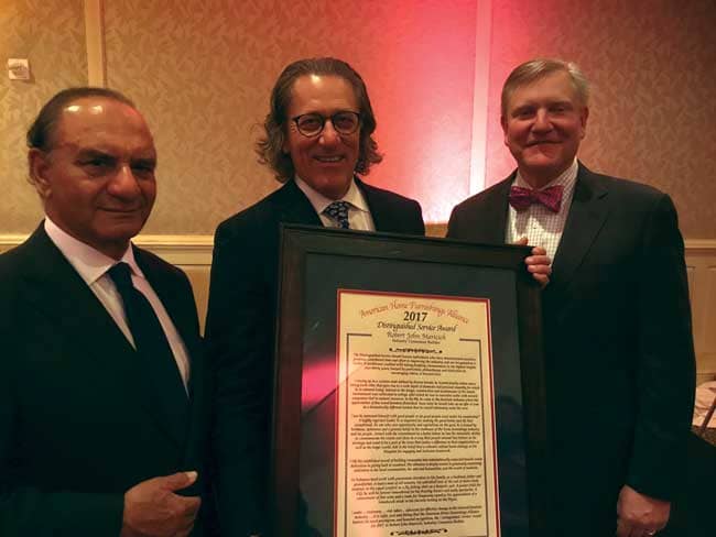 Robert J. Maricich, CEO of International Market Centers (center), has received the American Home Furnishings Alliance 2017 Distinguished Service Award. Presenting the award were Ethan Allen Chairman, CEO and President Farooq Kathwari (left) and AHFA CEO Andy Counts.