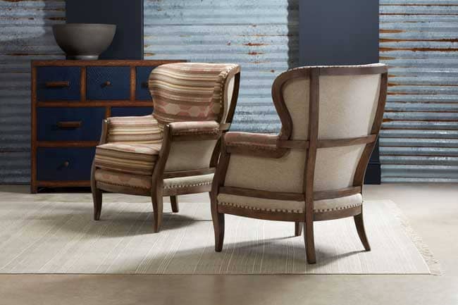 The Sam Moore Calhoun Chair features a includes a high back, subtle roll arms and shapely legs give the silhouette an updated classic feel.