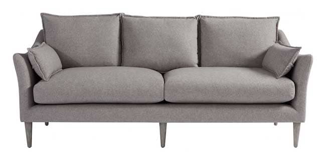 The Blair sofa features a modern flair arm with three over two seat configuration in soft gray felt performance fabric with self pillows, flange welting and a modern, high leg. 