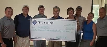 Pictured above - a check presented to National Autism Association – South East Ohio chapter