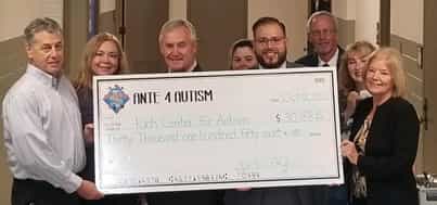 check to the Rich Center for Autism at Youngstown State University