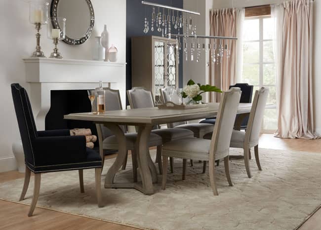 Pictured above is the Reverie rectangular Dining Room Table, Host chairs, Side chairs, and Display cabinet.