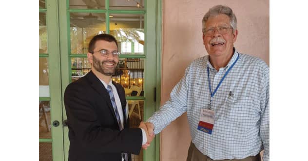 Keith Task of BASF (L) accepts congratulations from Bill Gollnitz, PFA Past President and Technical Program Moderator, for winning the Dr. Herman T. Stone Technical Excellence Award.